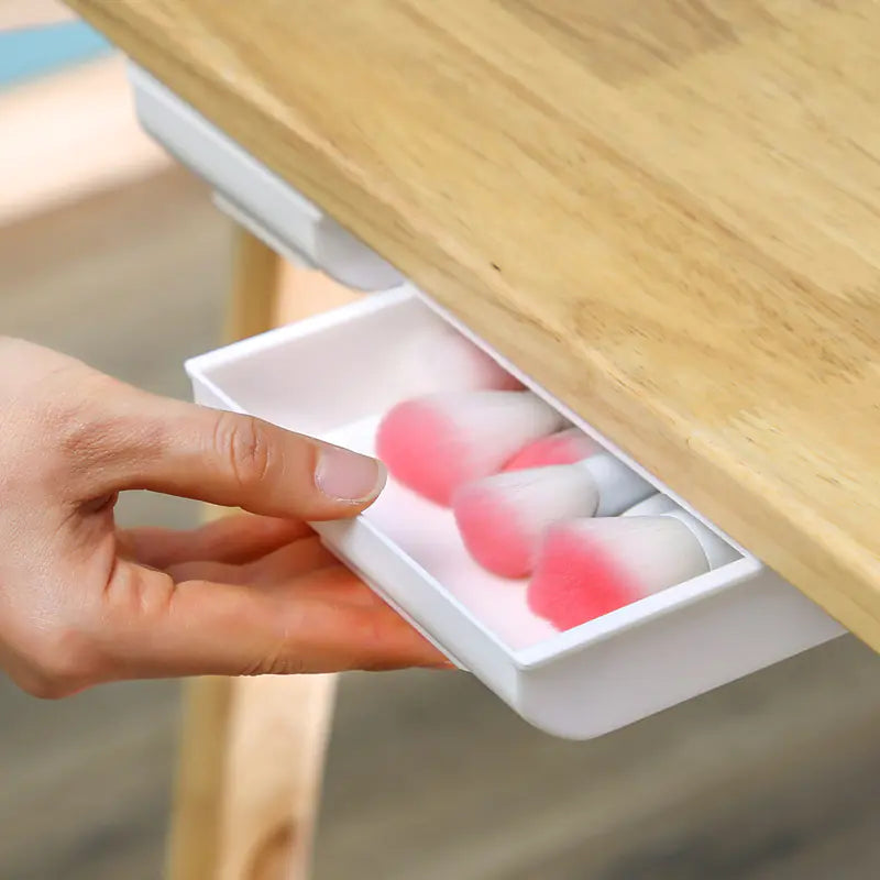 Under-desk adhesive drawer