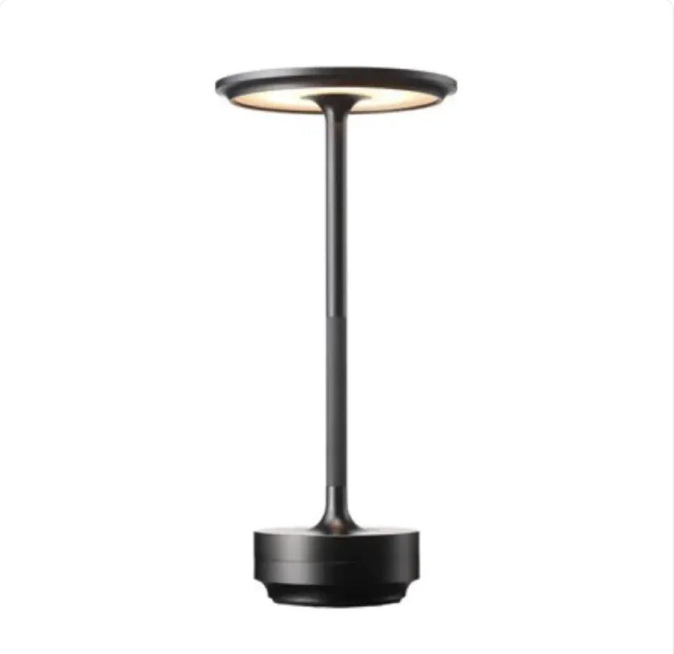 Desk lamp lit on a desk