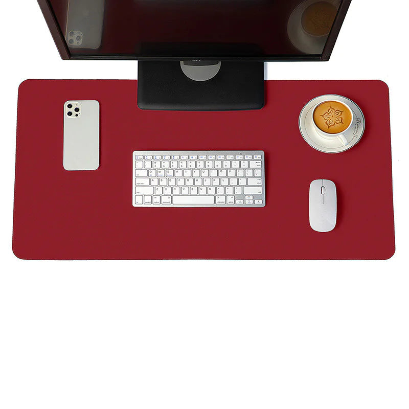 Leather desk mat under a keyboard and mouse